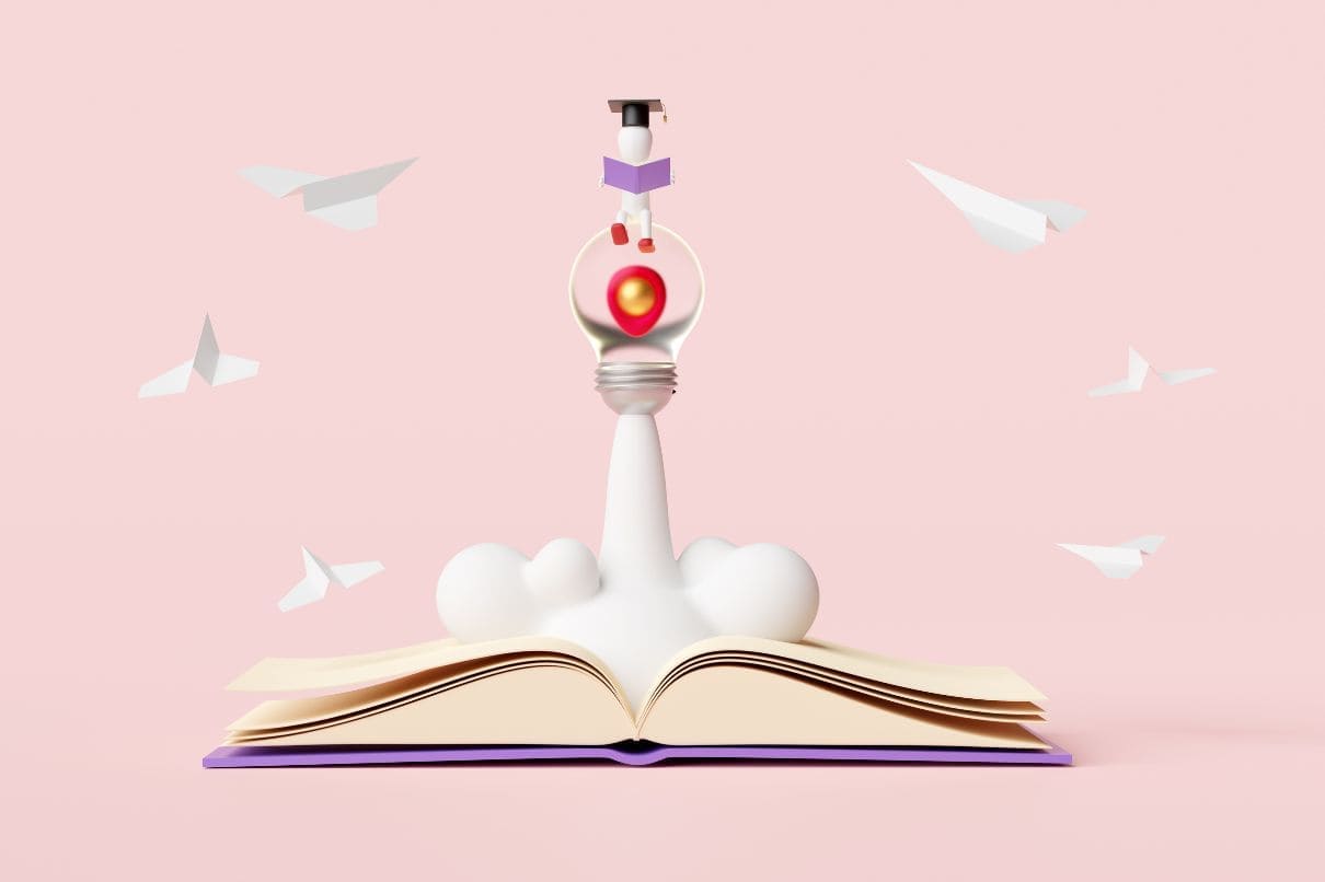 An open book with a light bulb on top, symbolizing knowledge and inspiration.